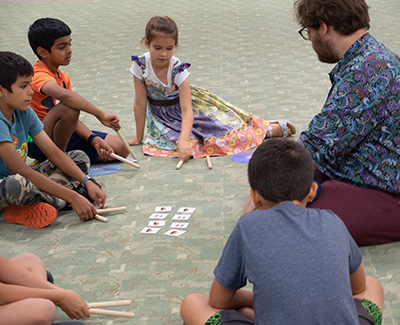 Children and Teacher playing game